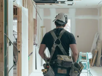 Professional contractor working inside a residential home remodeling project