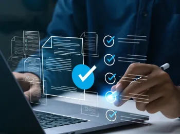 Business professional reviewing digital verification and evaluation information on a laptop