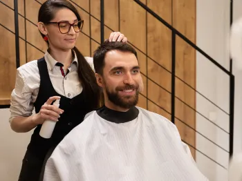 Professional barber providing hair care services to a client